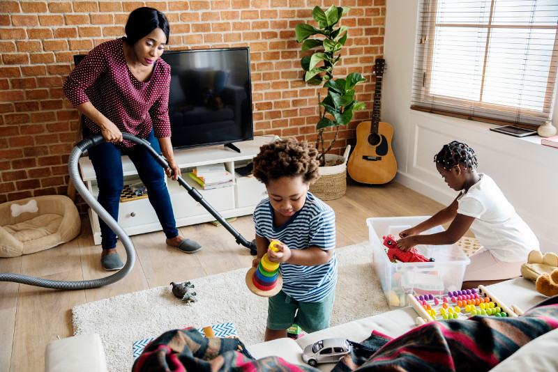 A family cleaning and tidying together.